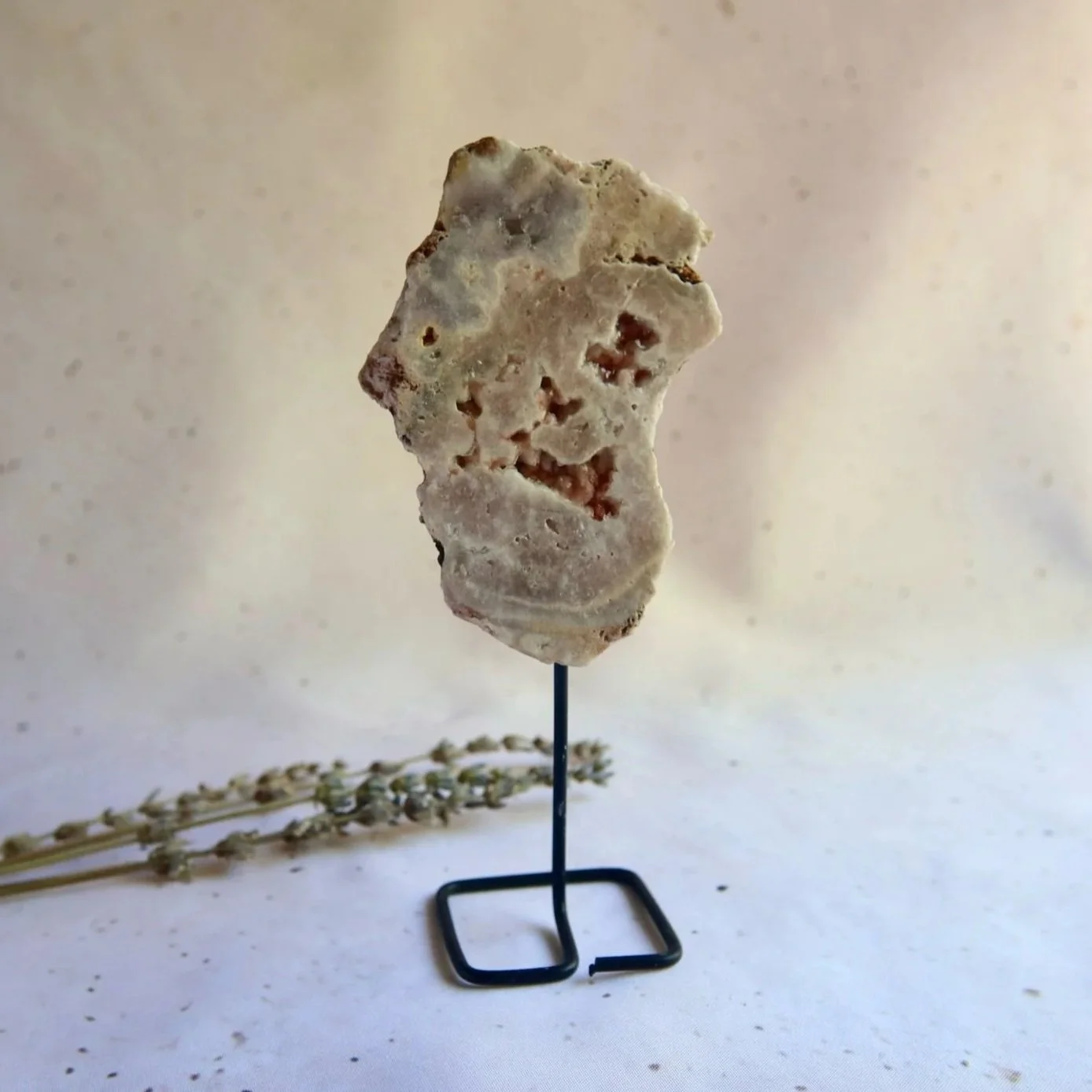 Pink Amethyst slab on stand with natural druzy pockets