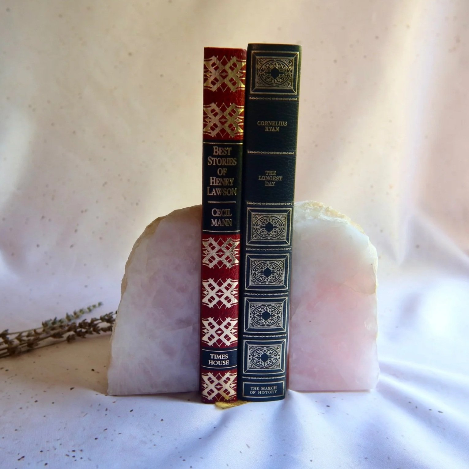 Natural Rose Quartz bookends displayed together on a bookshelf