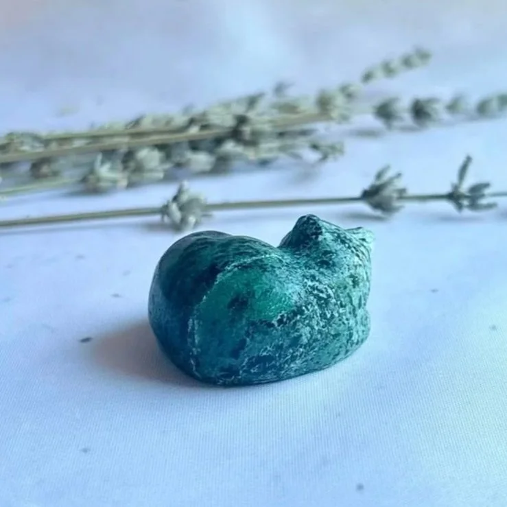 Genuine Zoisite crystal sleeping cat carving for collectors, cat lovers and crystal enthusiasts.