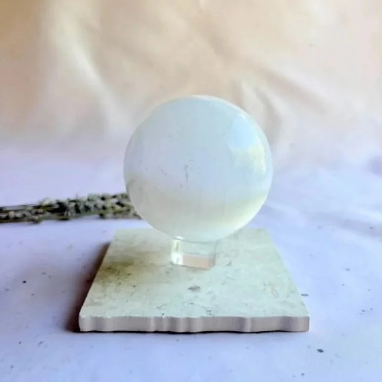 Large Satin Spar sphere displaying natural fibrous patterns and polished finish
