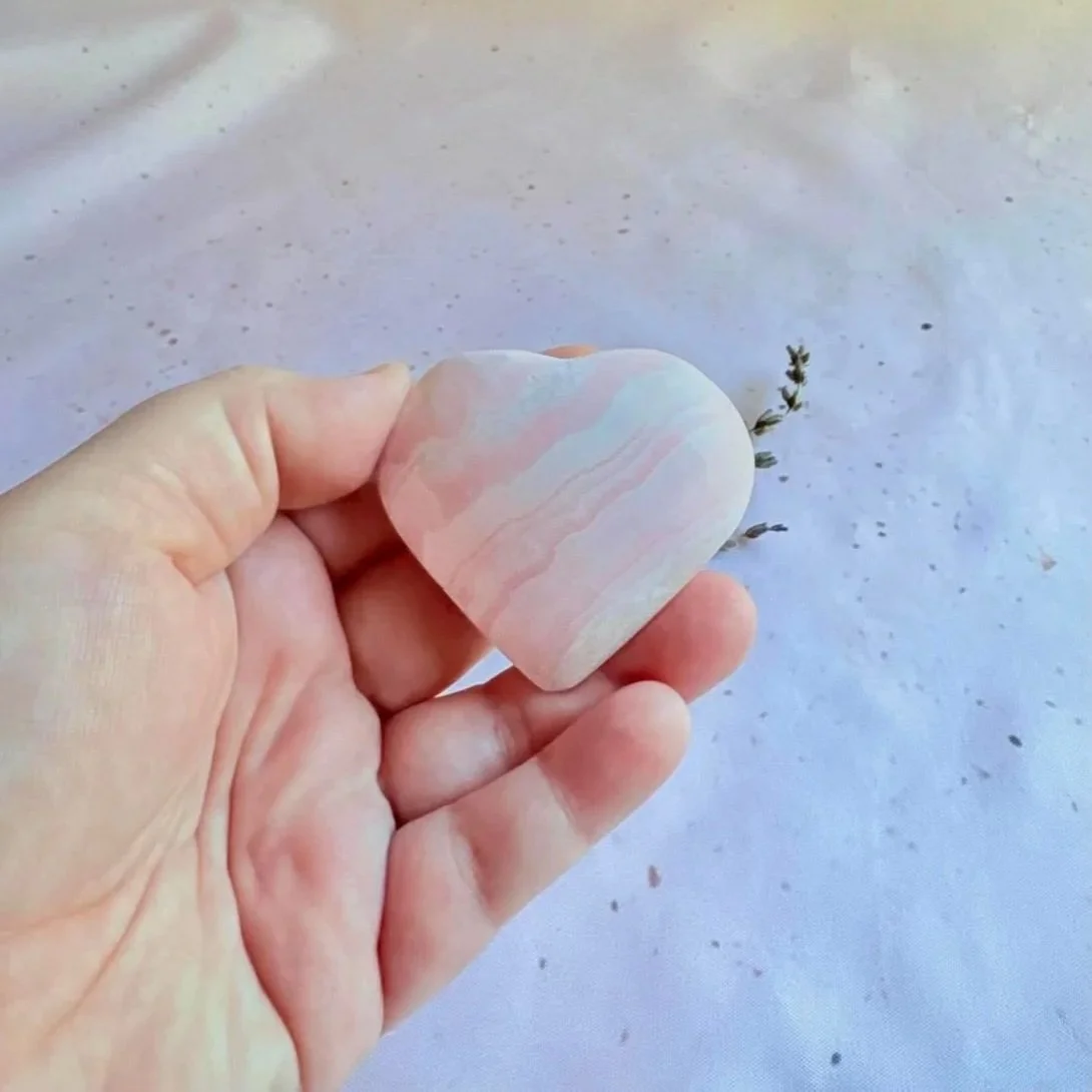Natural polished Mangano Calcite heart with soft blush pink colouring
