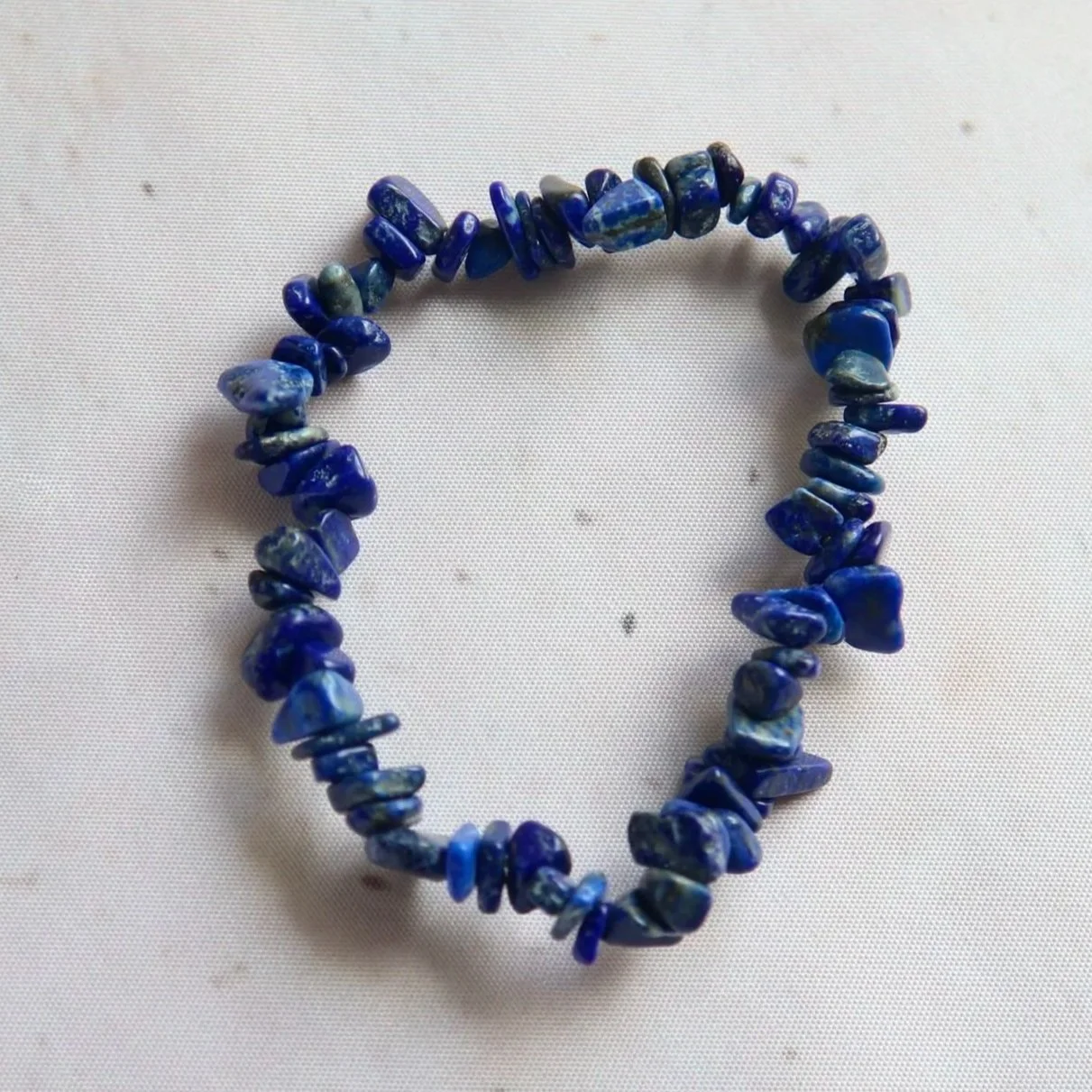 Lapis Lazuli chip bracelet featuring polished deep blue stone beads.