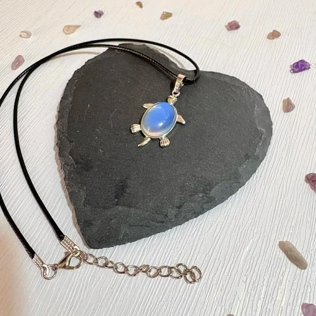 Opalite turntle pendant showing milky glow and soft colour shift