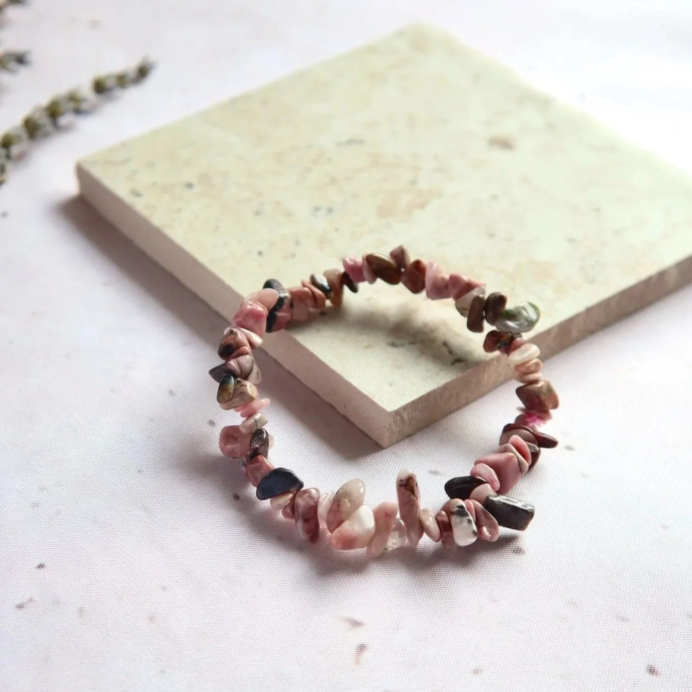 Rhodonite bracelet with soft pink tones and distinctive natural black markings