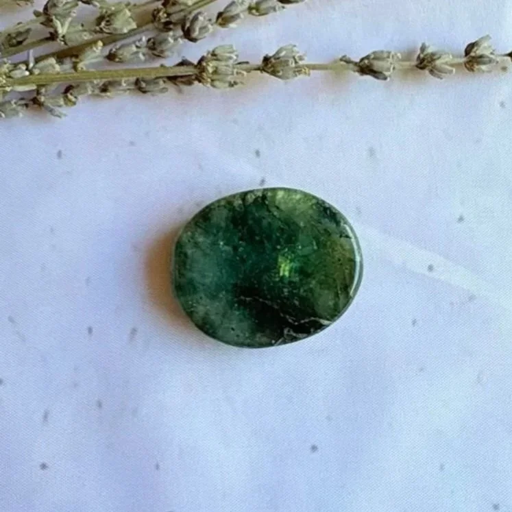 Natural Labradorite oval worry stone with polished finish and thumb indentation