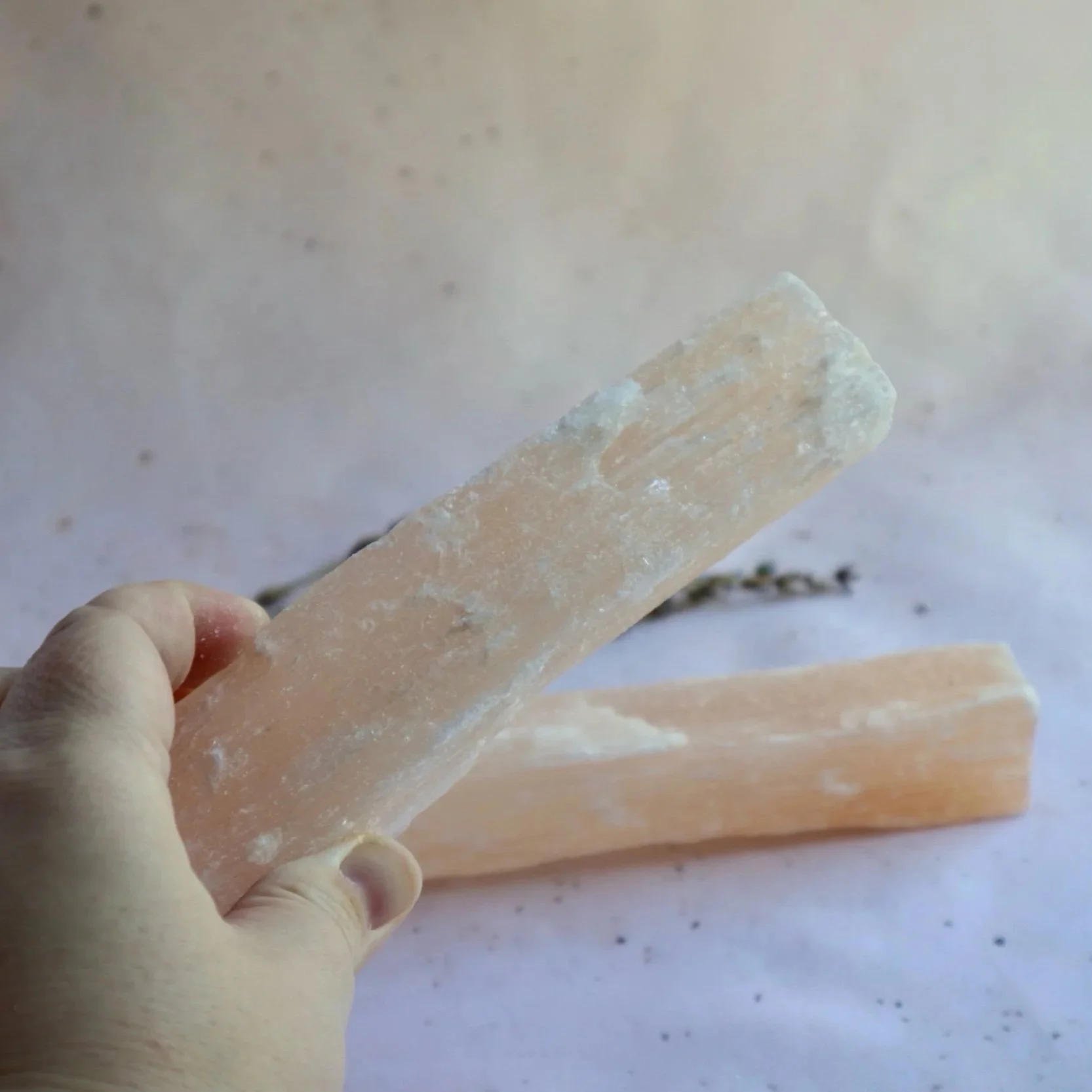 Satin Spar crystal sticks showing their natural fibrous texture
