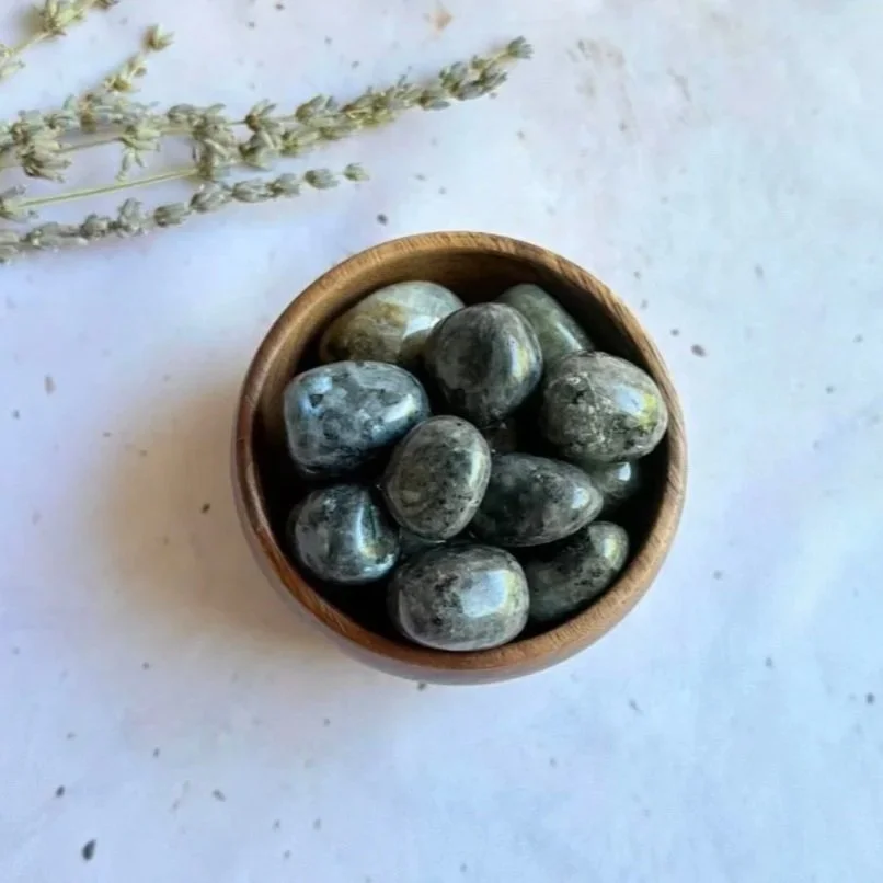 Larvikite tumble associated with grounding, protection, mental clarity, and focus