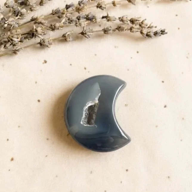 Purple grey Agate moon carving measuring approximately 5cm long with a natural druzy cavity