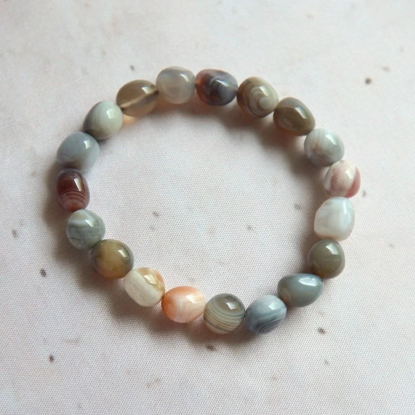 Botswana Agate tumble bead bracelet with natural earthy tones and unique banding