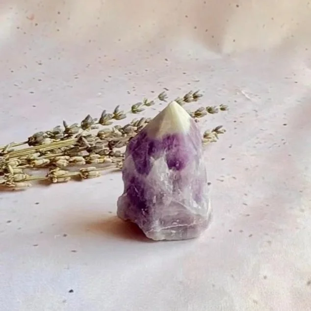 Natural Chevron Amethyst crystal tower displaying purple and white banding