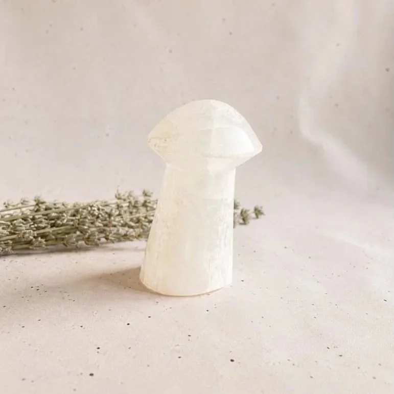 Carved Satin Spar mushroom displaying a silky white appearance and natural fibrous structure