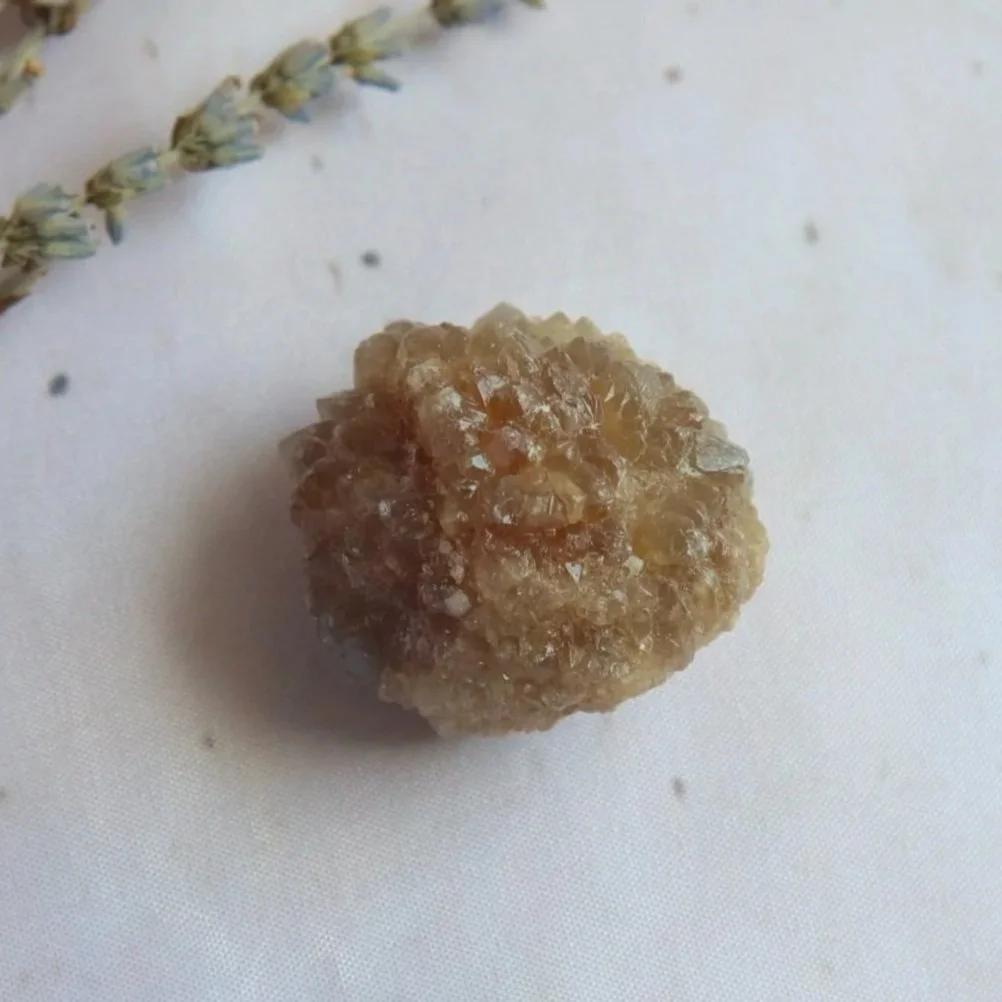 Small natural Citrine specimen showing honey-golden tones and irregular rough texture