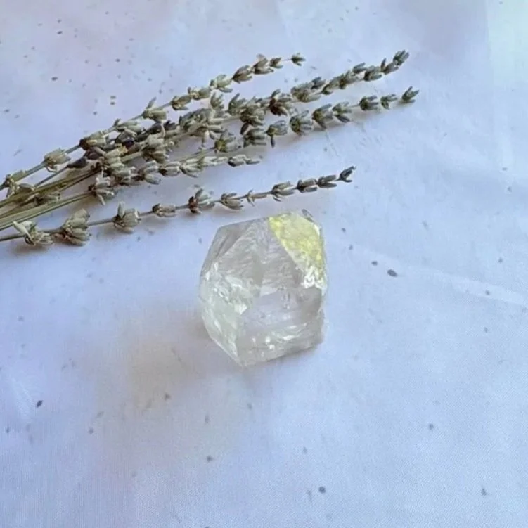 Exact Clear Quartz point with a polished finish and raw crystal texture