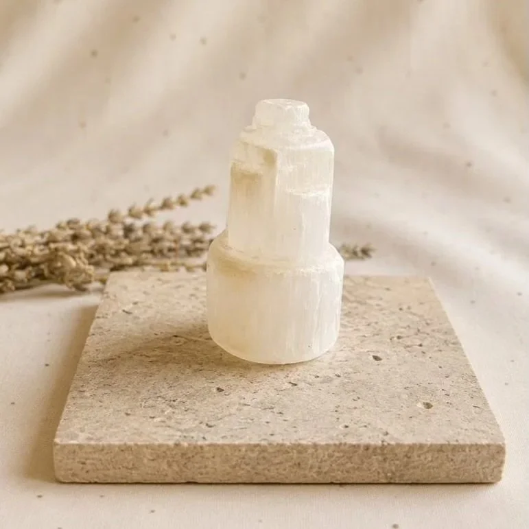 Natural white Satin Spar tower displaying rough layered crystal formations