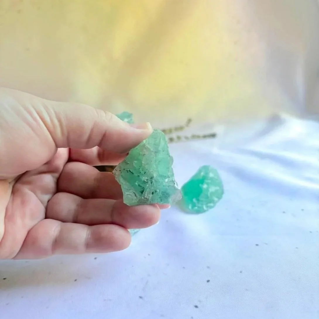 Raw Fluorite crystal displaying natural green and purple colouring
