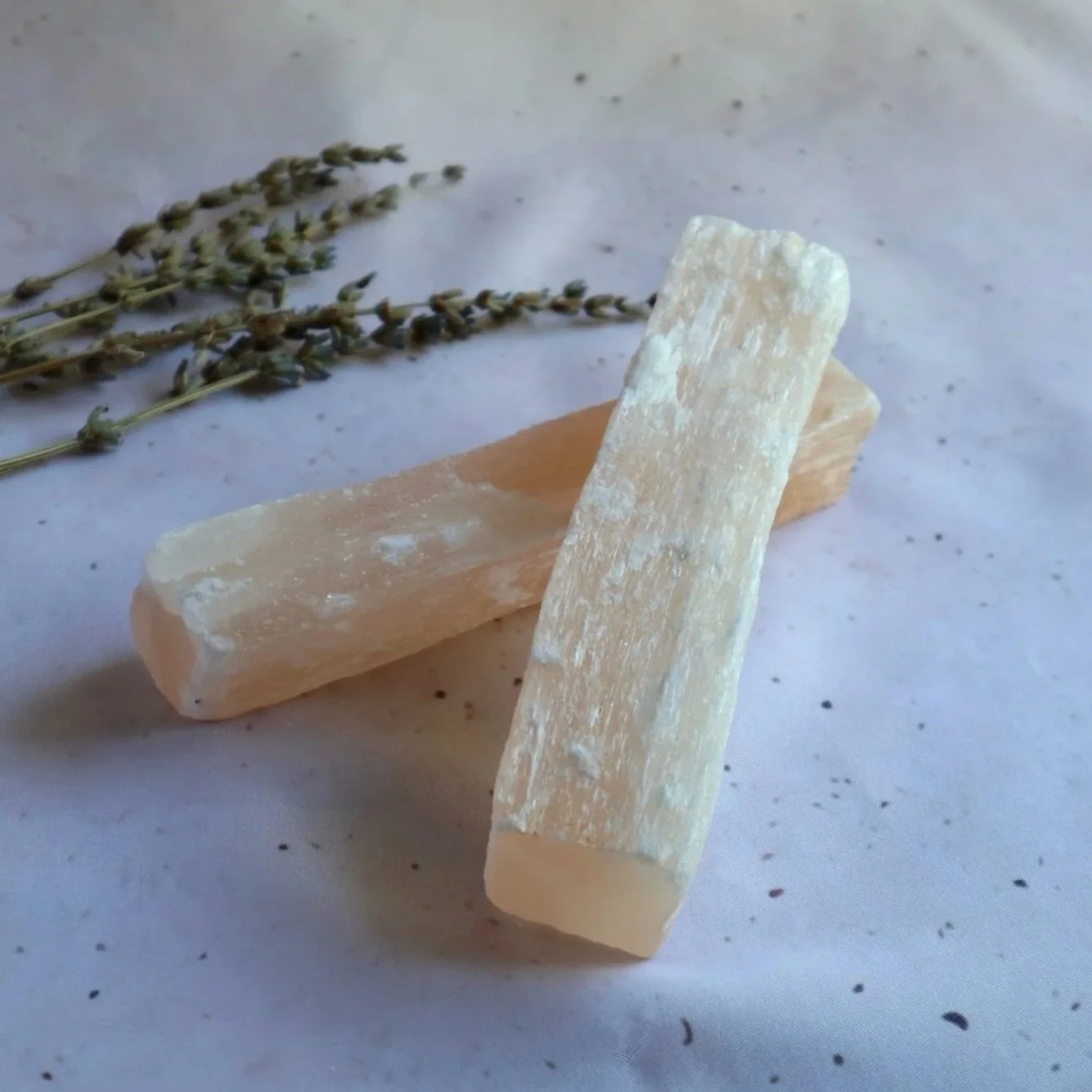 Natural Satin Spar crystal stick selected for its fibrous texture and soft white appearance