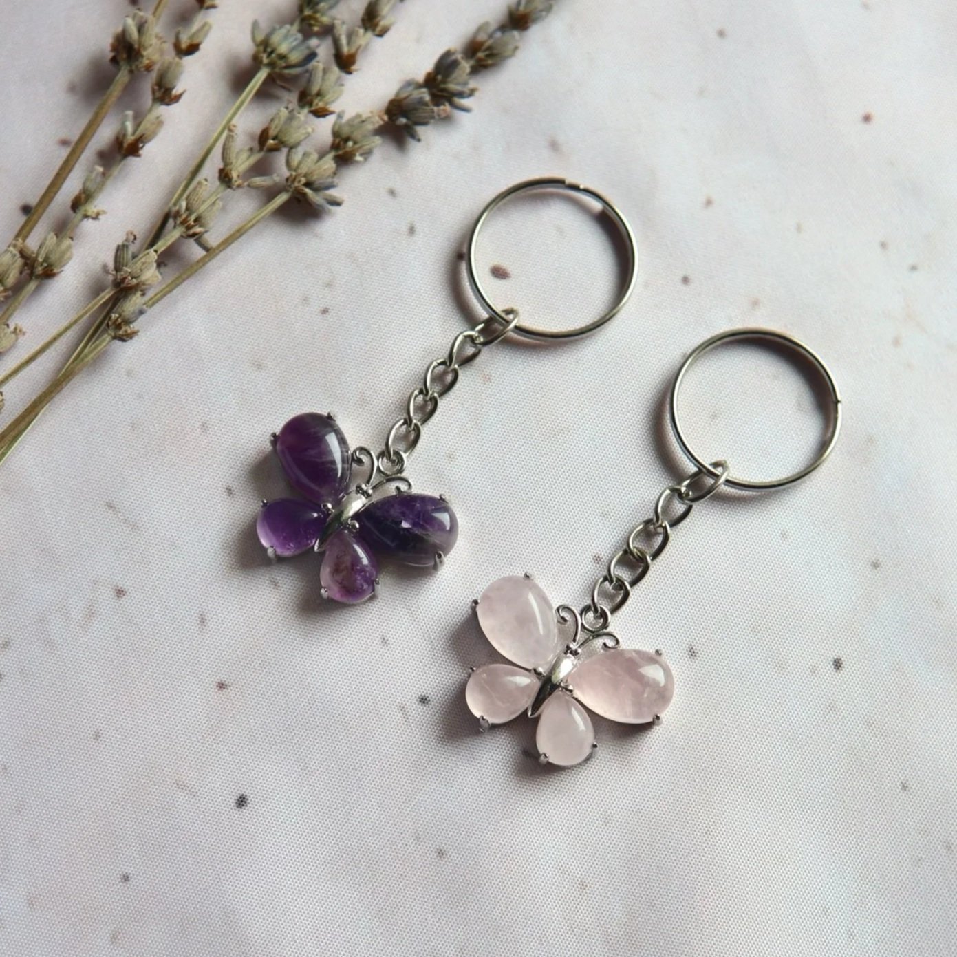 Butterfly gemstone keyrings featuring four teardrop cabochons in a silver-tone frame.
