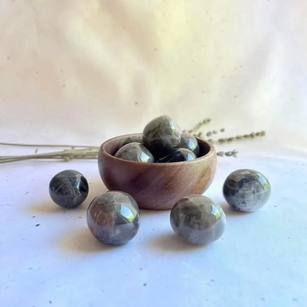 Black Moonstone tumble associated with intuition, protection, and new beginnings