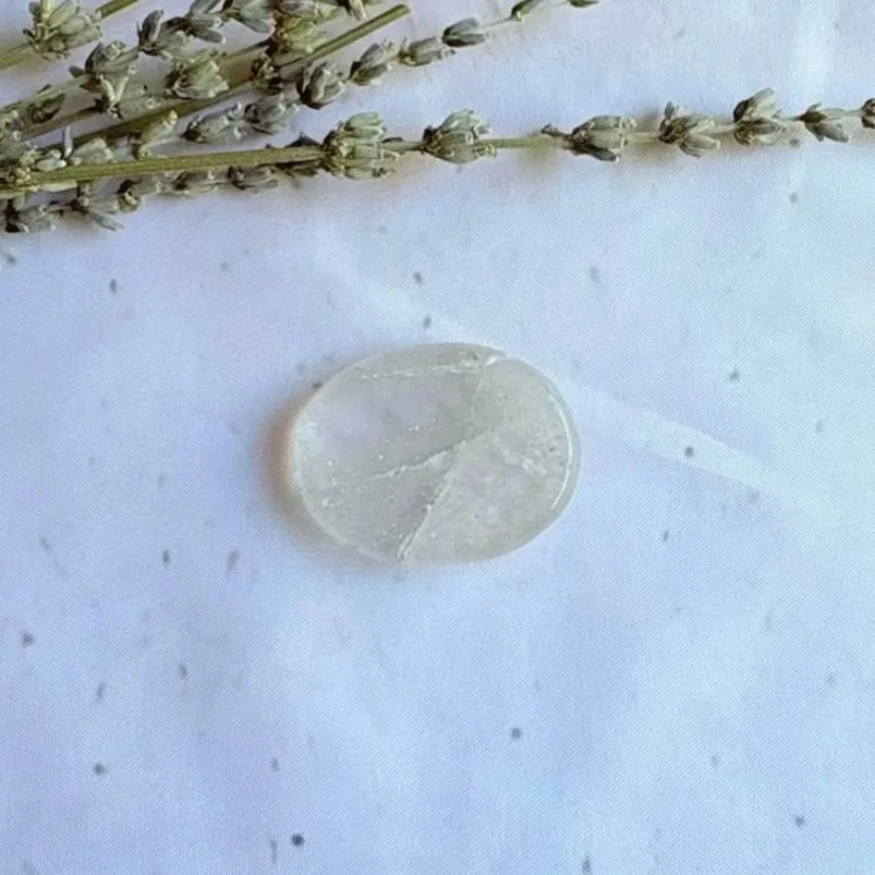 Natural Clear Quartz oval worry stone with polished finish and thumb indentation