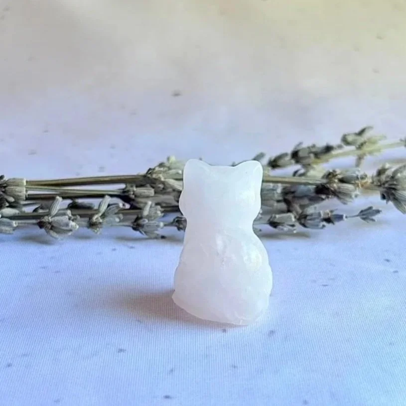 Rose Quartz cat carving associated with love, compassion, and emotional healing