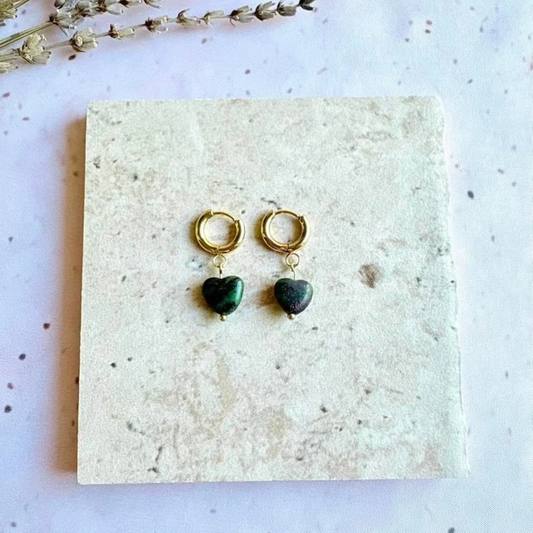 Gold-tone hoop earrings with Ruby in Zoisite heart crystal charms