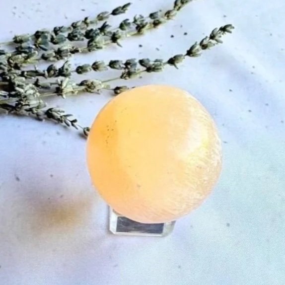 Polished Peach Satin Spar crystal sphere approximately 3.5cm