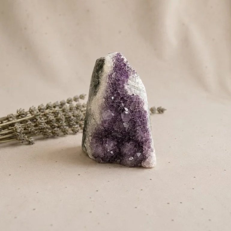 Natural Amethyst crystal cluster approximately 7cm tall with sparkling purple points