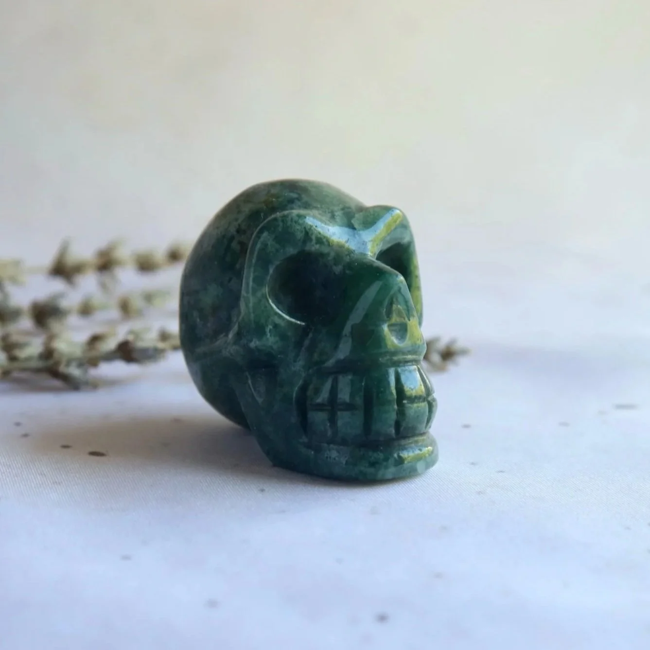 Green Moss Agate skull with natural green inclusions