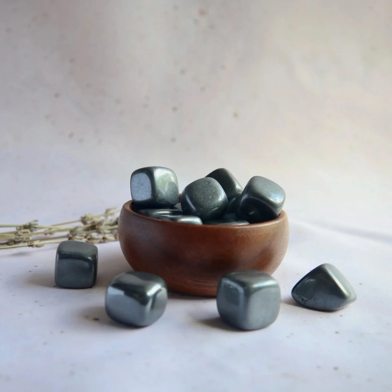 Chunky polished Hematite tumble with distinctive square-like shape and reflective metallic surface