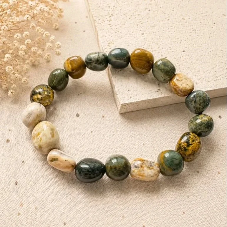 Natural Rainforest Jasper tumble bead bracelet featuring earthy green, brown, and cream gemstone beads on stretch elastic.