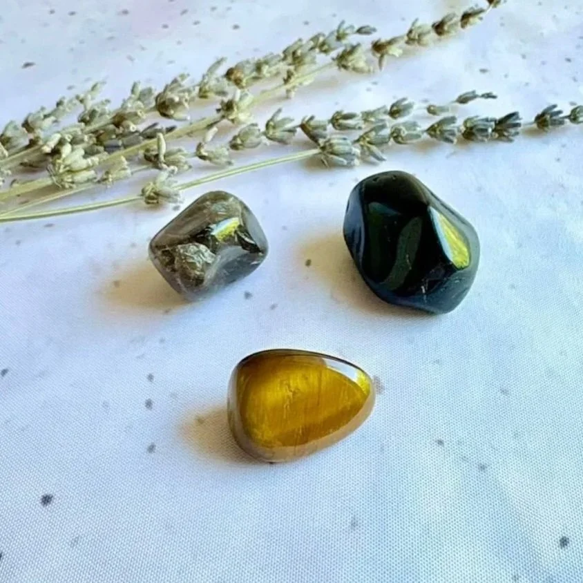 Pocket crystal pack featuring Black Obsidian, Tiger's Eye, and Smoky Quartz