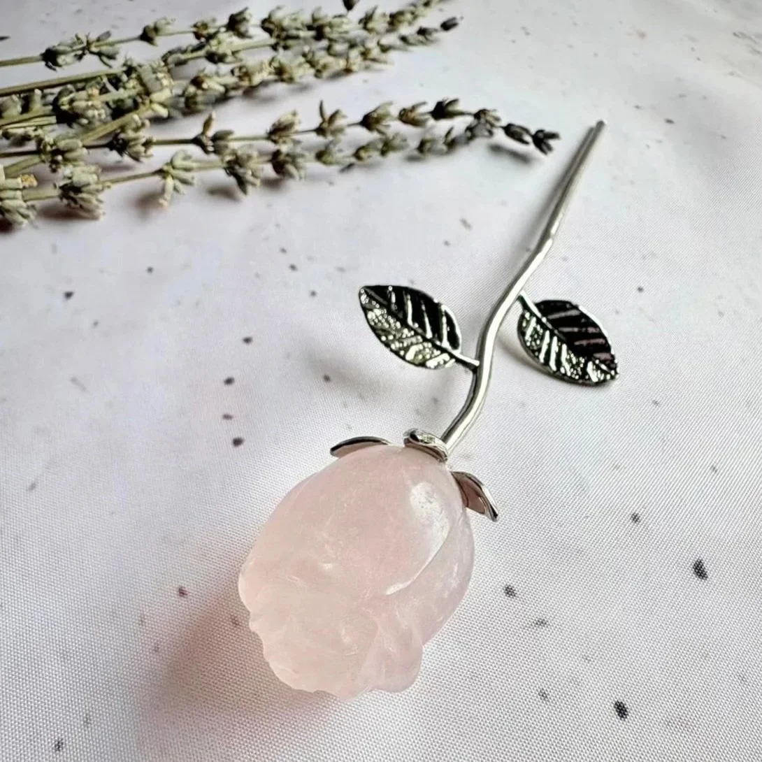 Rose Quartz crystal rose with gold coloured stem measuring approximately 16cm tall