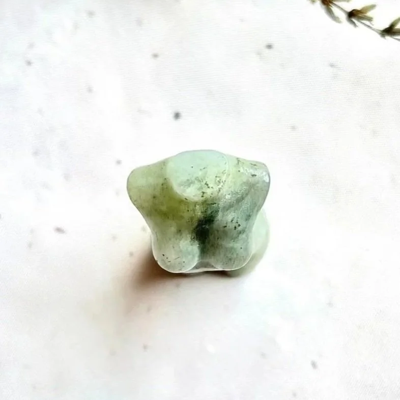 Labradorite crystal torso carving displaying natural flash and patterns