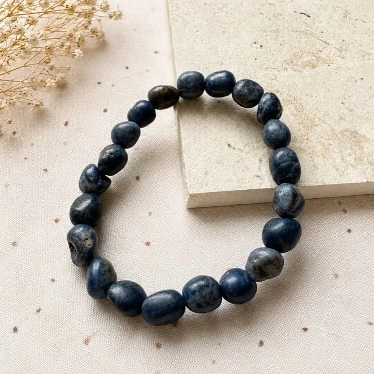 Sapphire tumble bead stretch bracelet featuring genuine blue crystal beads on elastic cord