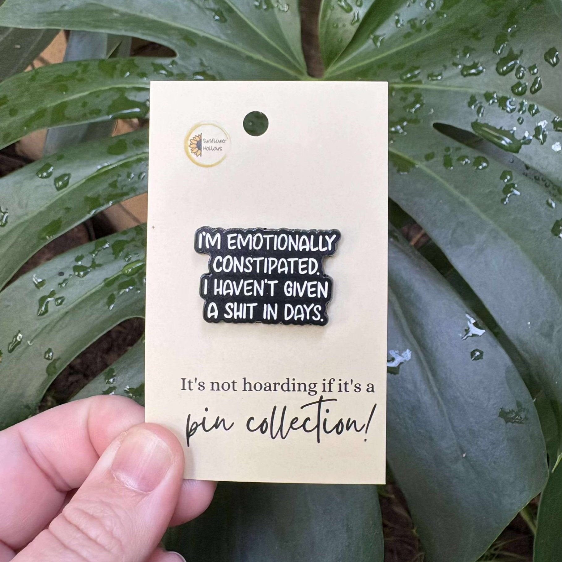 Funny enamel pin with emotional constipation quote, perfect for sarcasm lovers