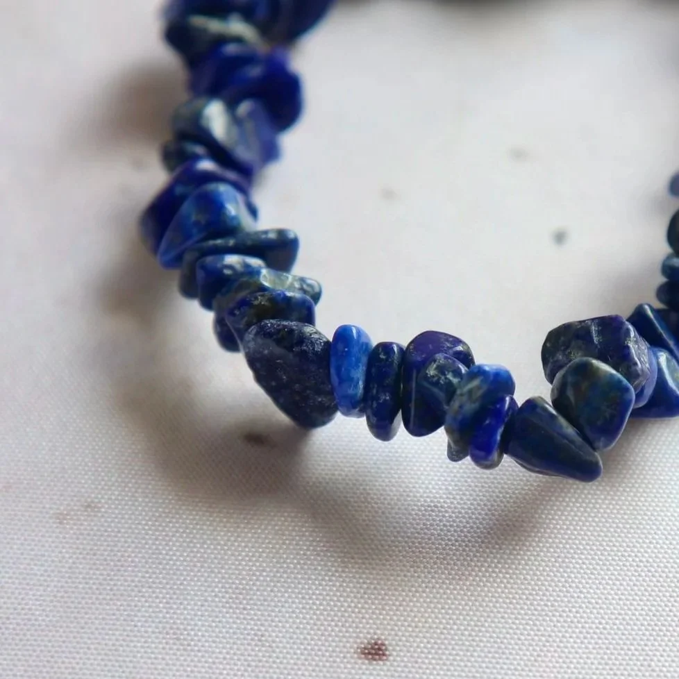 Close-up of the rich blue tones and natural markings in a Lapis Lazuli bracelet.