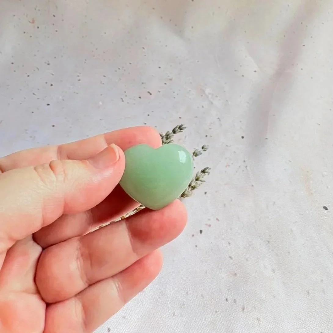 Green Aventurine puff heart associated with luck, abundance, and personal growth