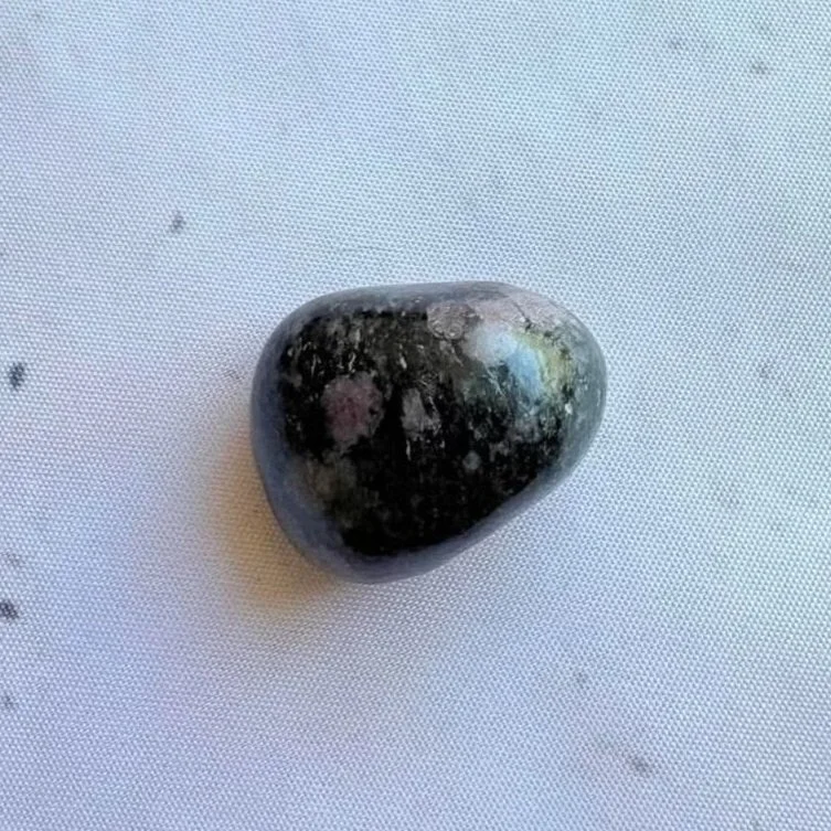 Ruby Schist tumble weighing approximately 21 grams with natural ruby inclusions