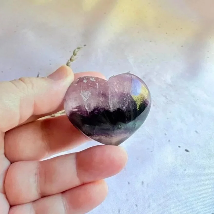 Natural purple Fluorite crystal heart polished to a smooth finish
