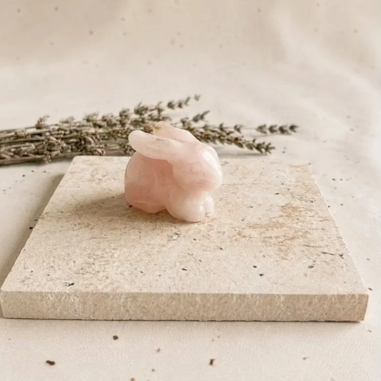 Natural Rose Quartz bunny carved from pink crystal with unique details and variations