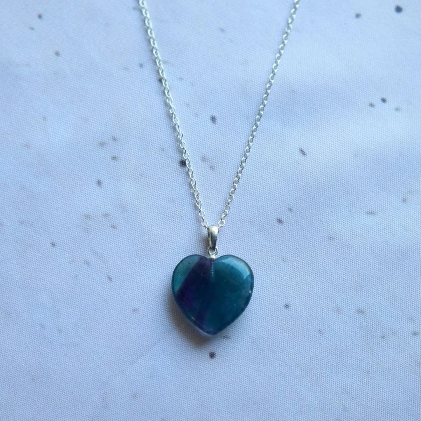 Rainbow Fluorite heart pendant necklace in sterling silver, with a gemstone pendant measuring approximately 2 × 3 cm including the bail.