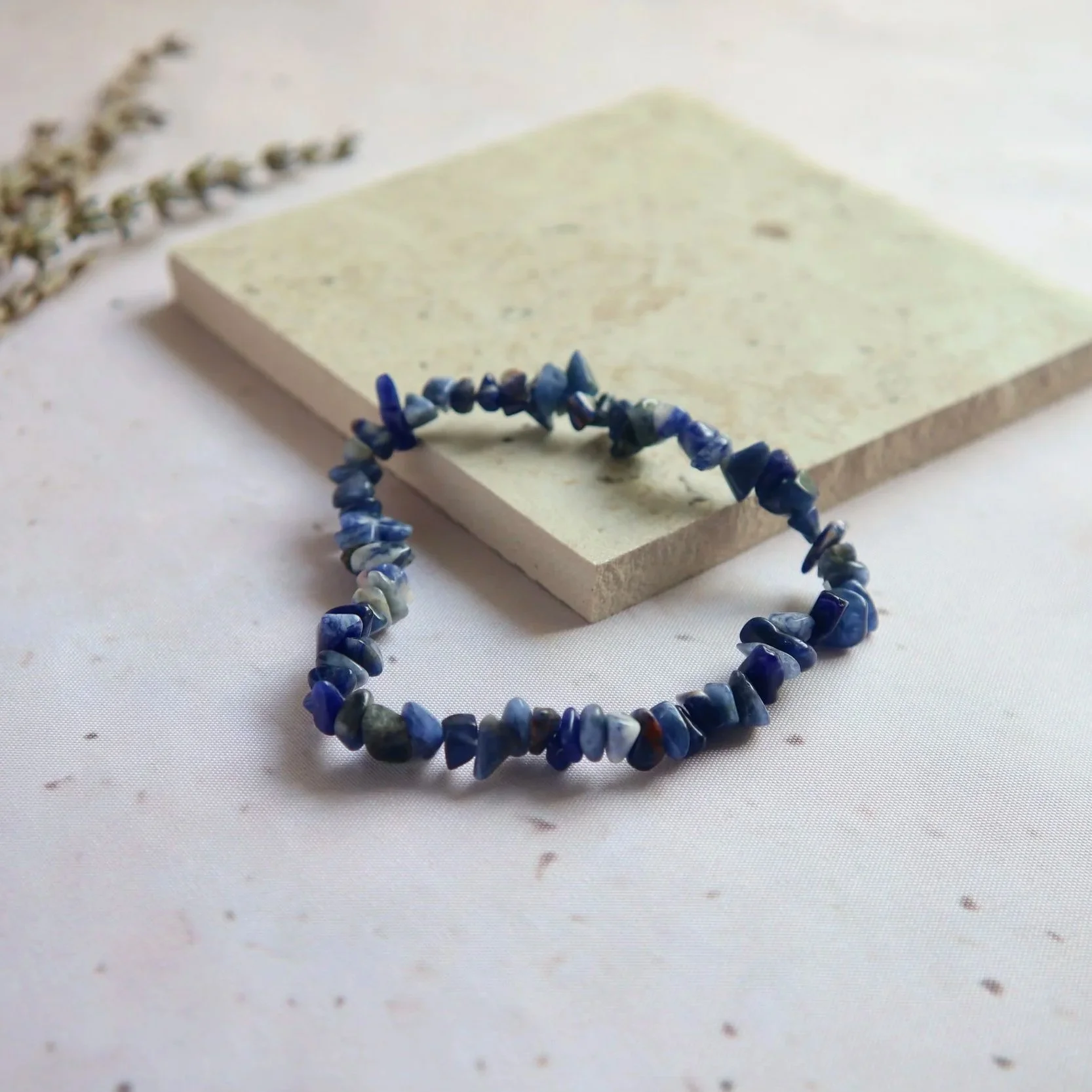 Sodalite bracelet displaying rich blue tones with natural white veining and mineral patterns