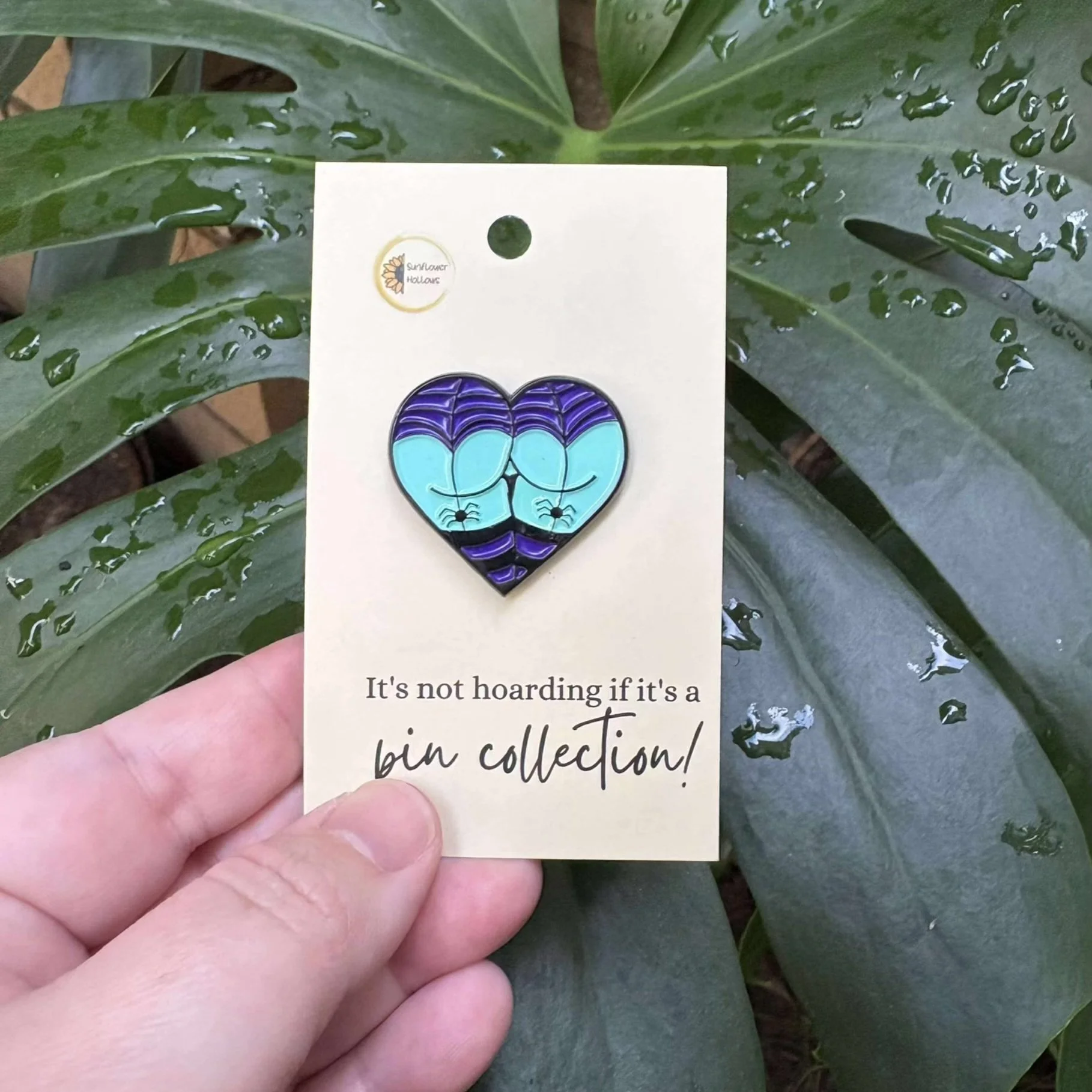 Love heart enamel pin featuring a cheeky butt wearing spiderweb underwear with small spiders, quirky and spooky accessory