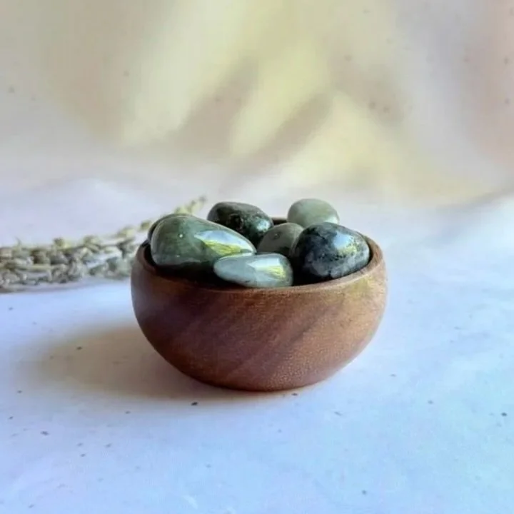 Natural Labradorite tumble displaying iridescent flashes of blue and green