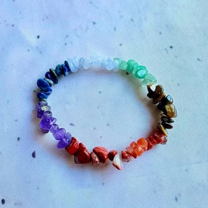 Natural chakra chip bracelet featuring colourful crystal chips on a stretch band