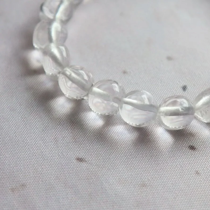Natural Clear Quartz crystal bracelet with rounded tumble beads and subtle inclusions