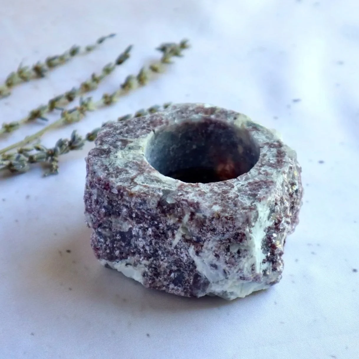 Lepidolite crystal candle holder showing natural mica sparkle and colour variations
