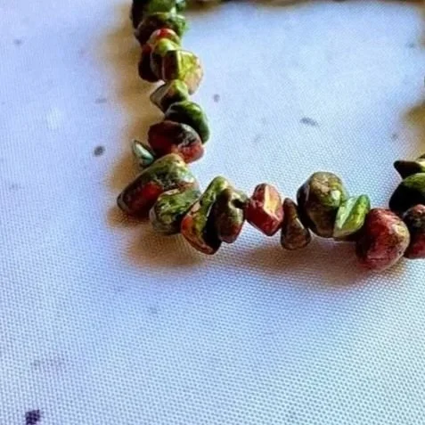 Unakite crystal chip bracelet featuring natural green and pink tones