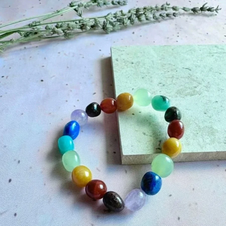 Stretch bracelet featuring assorted natural crystal beads in mixed colours