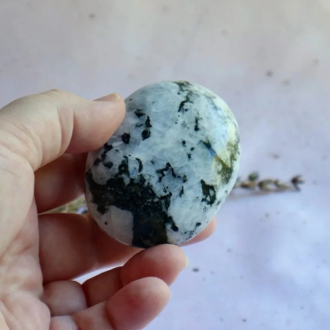 Rainbow Moonstone palm stone with white and contrasting dark natural patterns